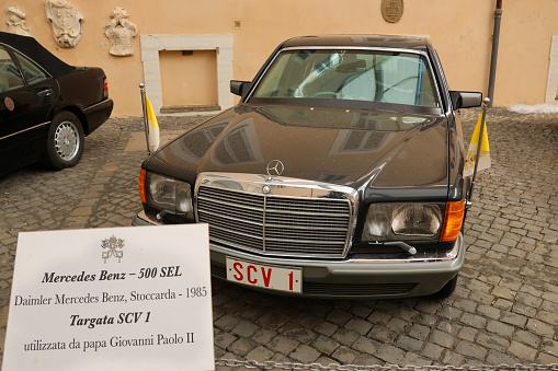 Castel Gandolfo Rome, Italy - January 12, 2023: The Popemobile of Pope Wojtyla John Paul II, the model is a Mercedes Benz 500 SEL, 1985 issue, located in the summer residence of the Pope