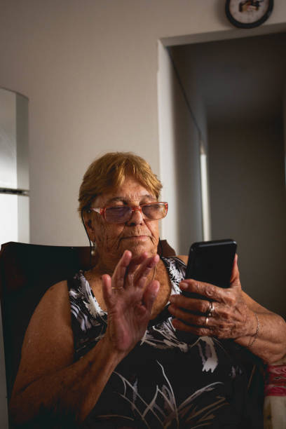 istock elderly woman uses smartphone 1463876992