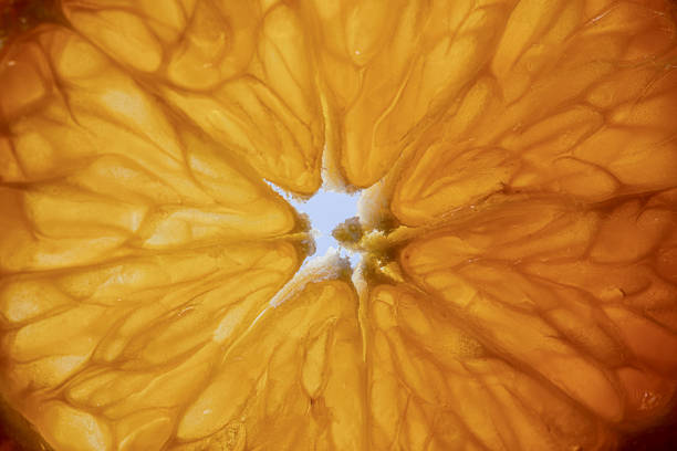 istock Sliced sweet ripe tangerine close-up 1463877702