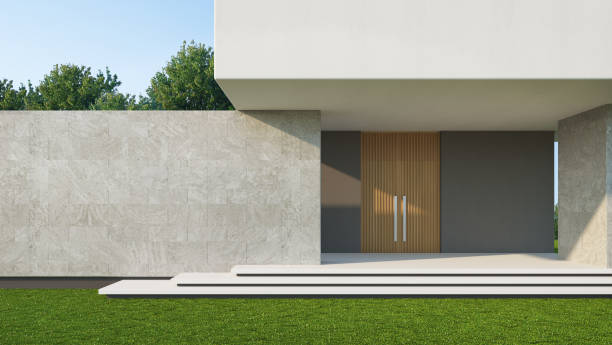 istock House entrance with stone wall and lawn grass.3d rendering 1463877966