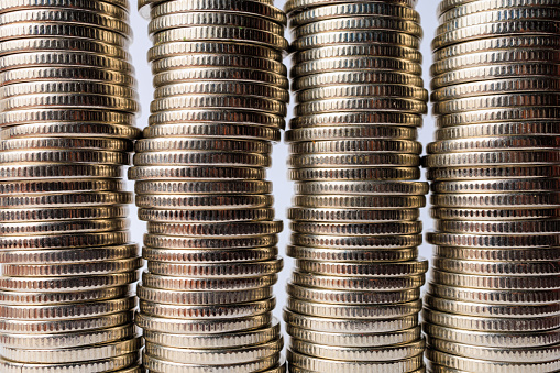 Background of stacks of coins. Business backdrop. Textured surface close-up