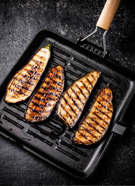 istock Slices of eggplant in a grill pan. 1463879668
