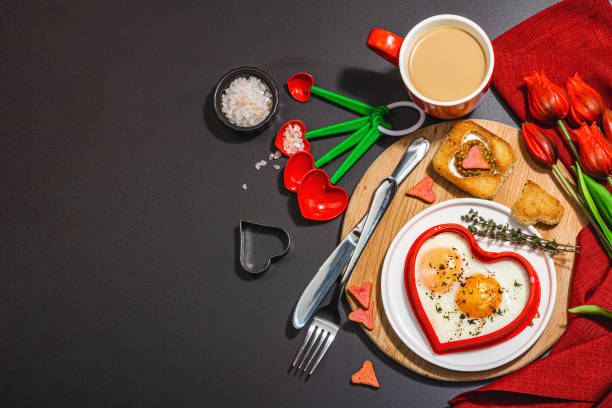 istock Heart-shaped fried egg served with toasted bread. Romantic art food idea for Valentine's breakfast 1463879944