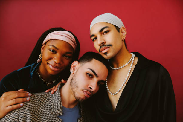 istock Three confident multi ethnic friends against red background 1463883031