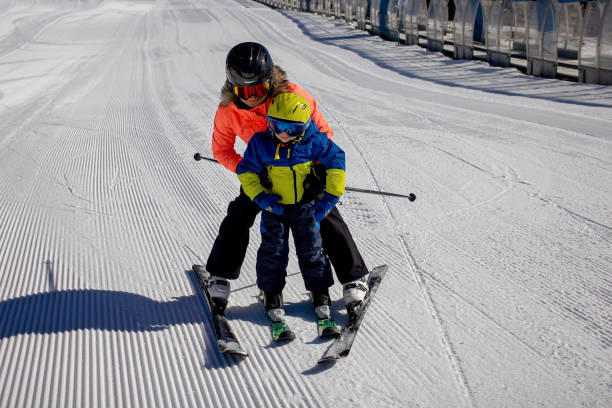 Happy family, skiing in Italy on a sunny day, kids and adults skiing together Happy family, skiing in Italy on a sunny day, kids and adults skiing together. Family vacation ski instructor stock pictures, royalty-free photos & images