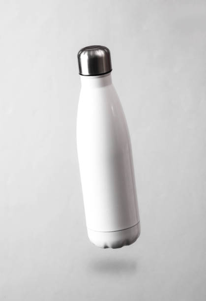 istock White thermal bottle levitating on a gray background with a shadow 1463885908