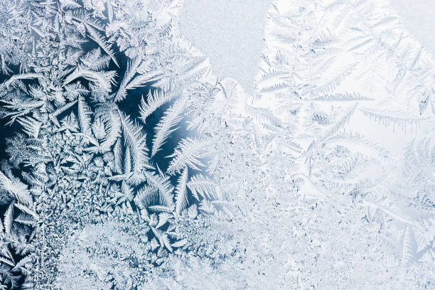 istock Frost pattern on a window glass, macro photo, natural winter photo 1463887315