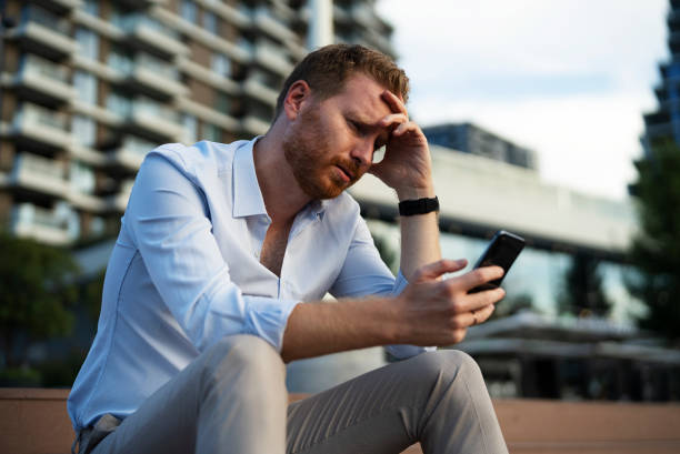 istock Angry upset man talking to the phone 1463889067