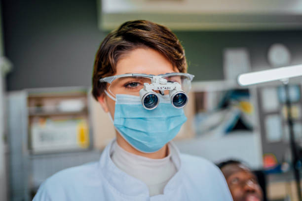 istock Female dentist in dental office 1463889868