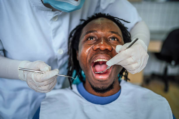 istock Young man at the dentist's office 1463890089