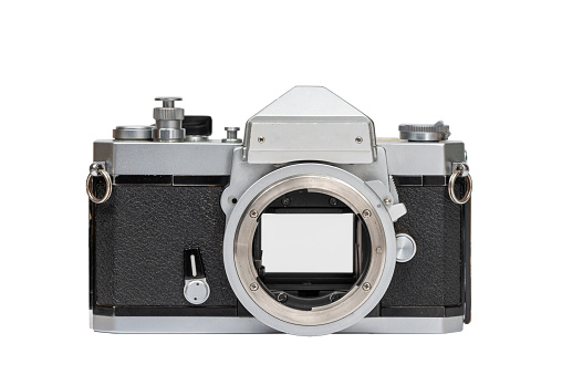 With lens and camera back removed, viewer can see how instant return mirror rises to expose the shutter/film, and how the shutter opens to allow image to reach film frame.