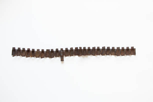 istock Machine-gun belt torn from a Russian tank on a white background 1463891871