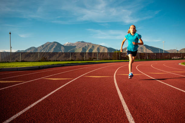 istock Young Child Running on Track 1463891997