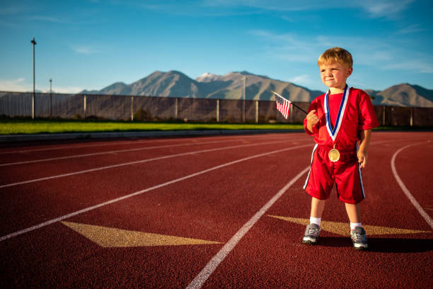 istock Young Child Running on Track 1463892000