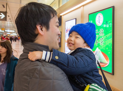 24-03-2015 Kyoto. Father and son (child) in his arms (both smiling) in Kyoto. I think Kyoto is a more human city than the prim capital Tokyo.