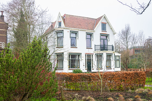 Gouda, Netherlands - February 2023: Idyllic view of a historic villa in the city of Gouda, Holland.