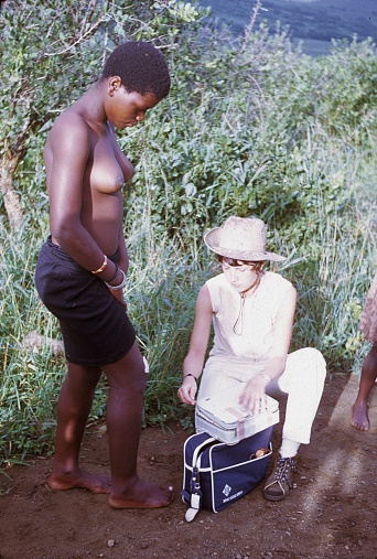 South Africa, 1971. Country doctor treating a Zulu woman's foot.