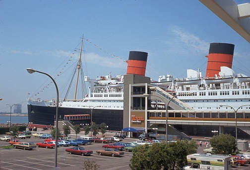 Greater Los Angeles, Long Beach, California, USA, 1975. The Queen Mary Hotel moored in Long Beach. Also: Parked vehicles.