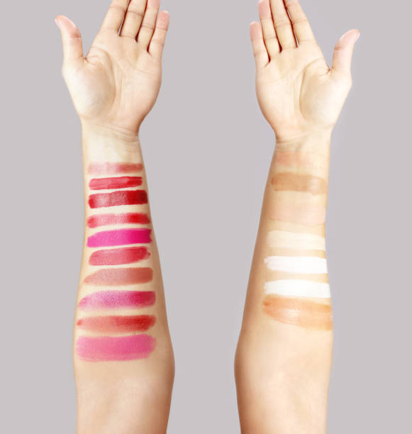 istock Female hand testing different lipsticks and foundation, showing swatches 1463897187