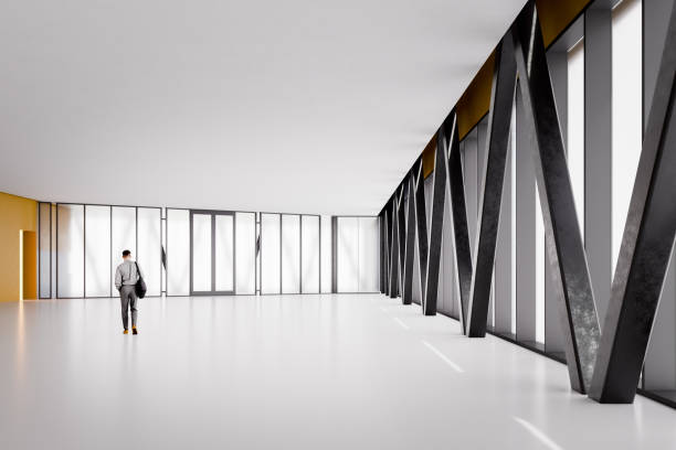 istock Businessman walking in empty office building corridor 1463902435