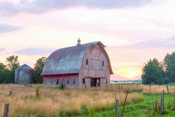 istock Old Weathered Red Barn at sunrise-Howard County, Indiana 1463904745