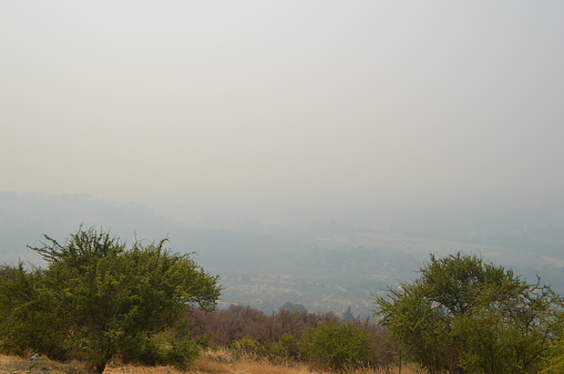 from the hill of the virgin Talca covered whit smoke by fires
