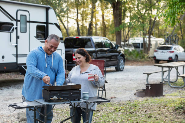 istock Mature multiracial couple at RV park, grilling 1463906695