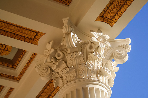 Pacific Palisades, California, USA – August 19, 2012: Architectural details of a Corinthian capital and white column at Getty Villa Museum in Pacific Palisades, California.