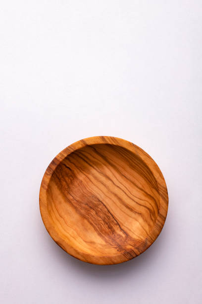 istock Wooden round bowl isolated on white background 1463924181