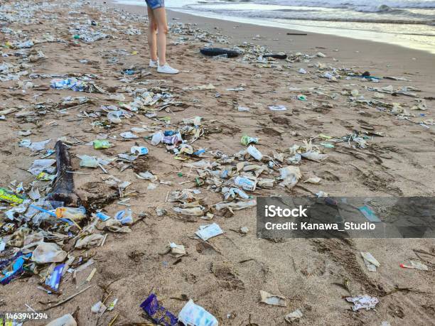 Unrecognizable Tourist Standing Around Plastic Waste Stock Photo - Download Image Now