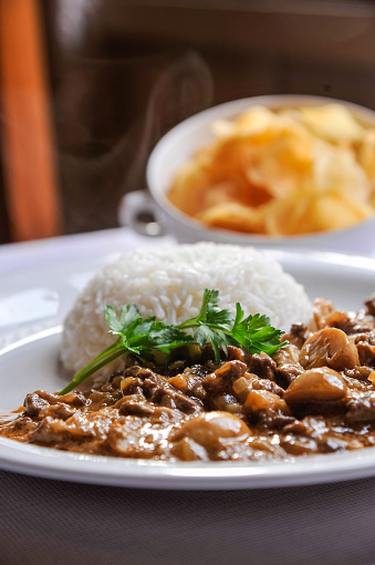 Stroganoff with white rice and french fries