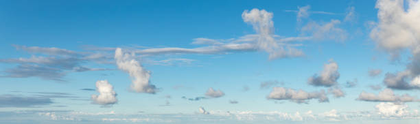 istock Beautiful blue sky and white fluffy clouds 1463945112