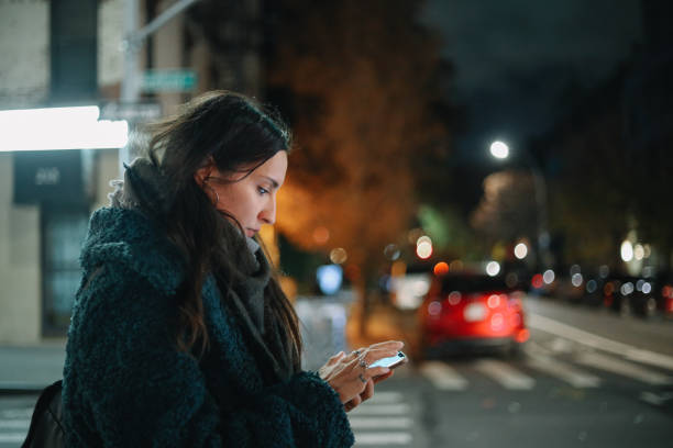 istock checking apps on the go in the evening walk 1463953339