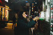 woman buying street food in a Brooklyn food truck