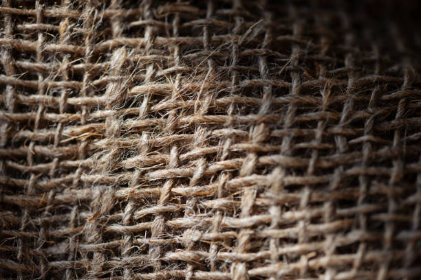 istock Texture of burlap fabric in sunlight. 1463960916