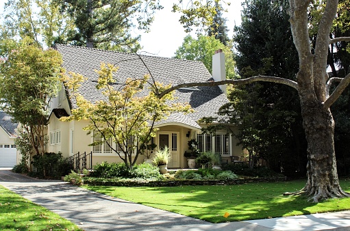 On 9/30/2019 a drive through the old town area of Sacramento California one can see the variety of vintage homes that have been carefully maintained.  This house is a soft color.