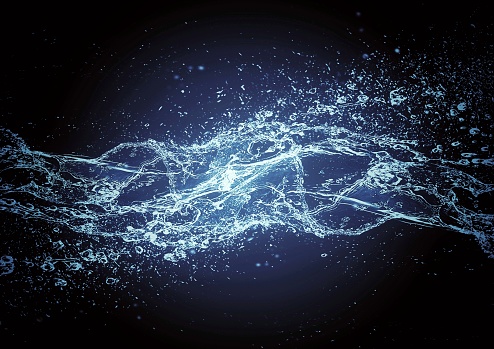 Abstract blue water splash and black background in natural environment concept