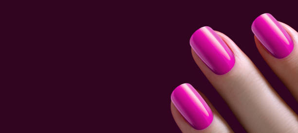 istock Pink nail Polish on long nails on a dark background. 1463974885