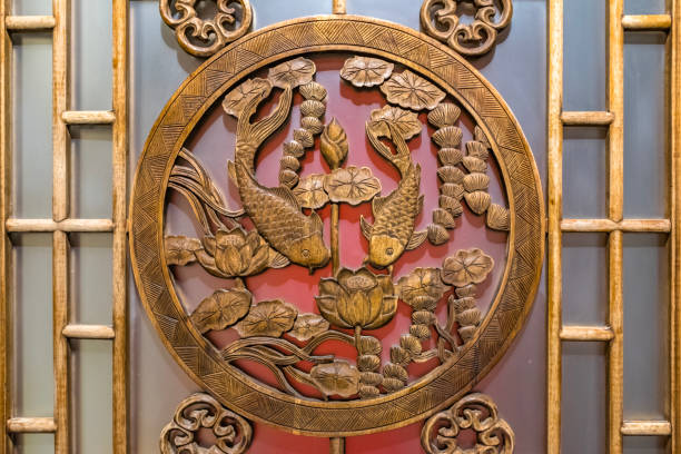 Wooden windows carved with koi and lotus patterns