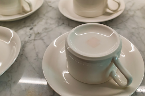 White teacup overturned on saucer