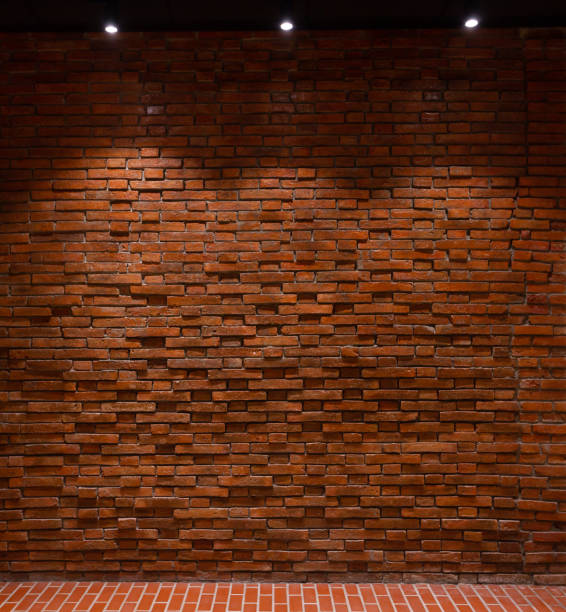 istock Red brick wall with lights shining from above Suitable for making background images of infographics. 1463985668