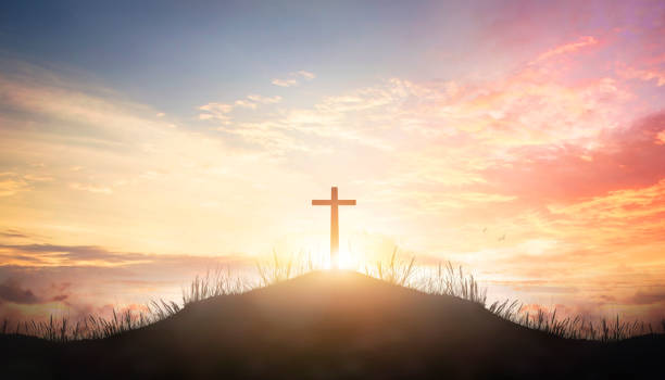 istock Christian cross on hill outdoors at sunrise 1463986810