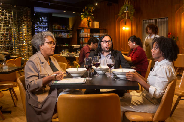 istock Executives at a business dinner in a sophisticated restaurant 1463987335