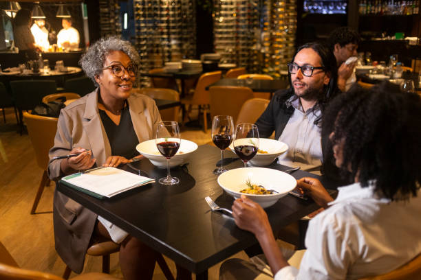 istock Executives at a business dinner in a sophisticated restaurant 1463987347