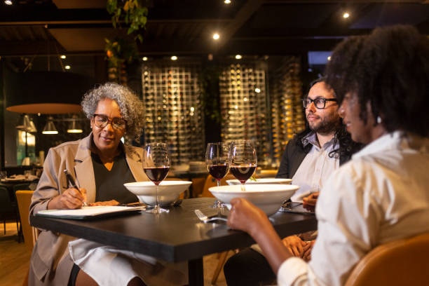 istock Executives at a business dinner in a sophisticated restaurant 1463987349
