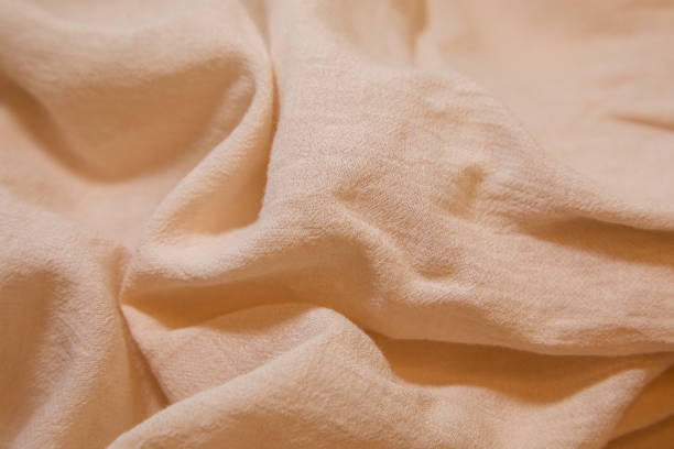istock Pink fabric background. Pink cloth waves background texture. Pink fabric cloth textile material. 1463990296