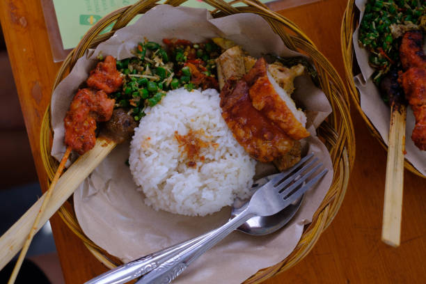 istock Delicious Suckling Pig Served on a Rattan Plate with Rice 1463990951
