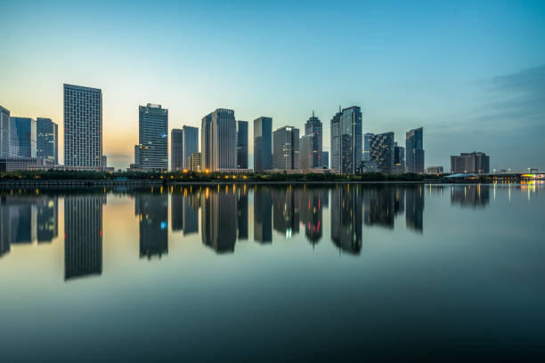 istock Modern buildings near water at dusk 1464000028