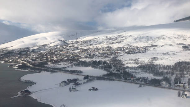 istock View from plane window over snow covered, Tromso, Norway 1464006648