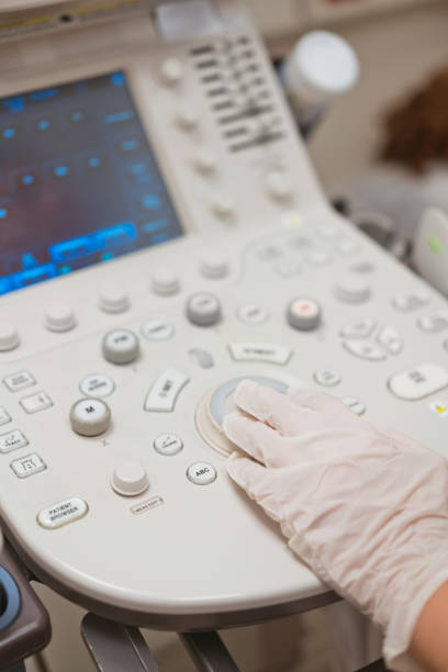 istock Female doctor doing ecography test 1464013476
